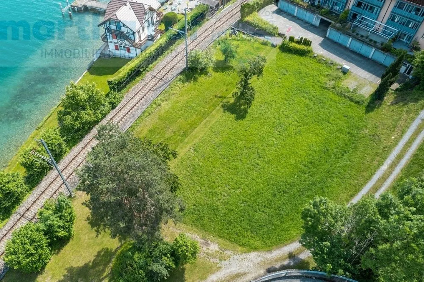 Baulandparzelle mit Seezugang - Foto 8 von 11