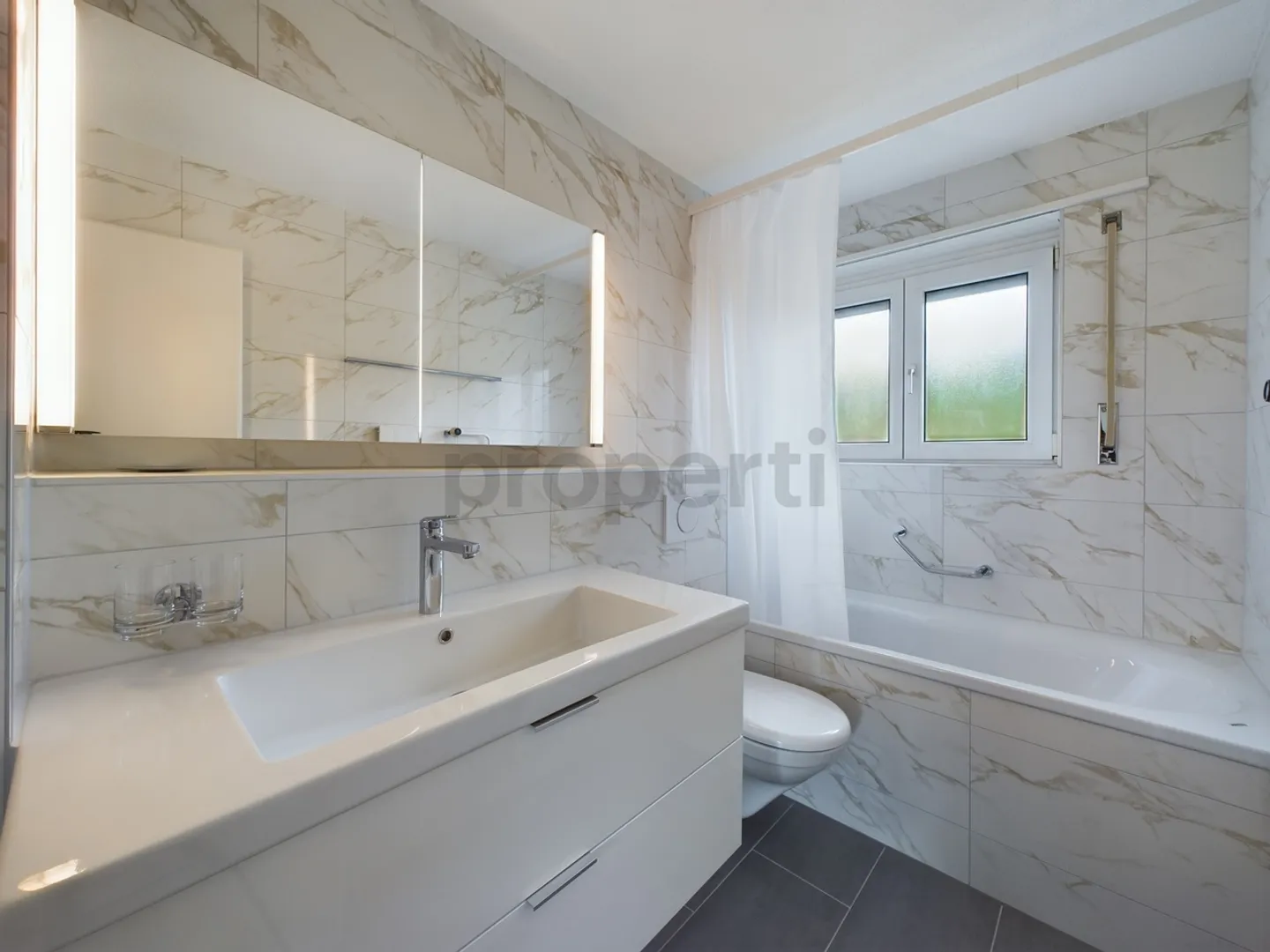 Well-maintained multi-family house with 6 residential units & 9 garages - Photo 7 of 13