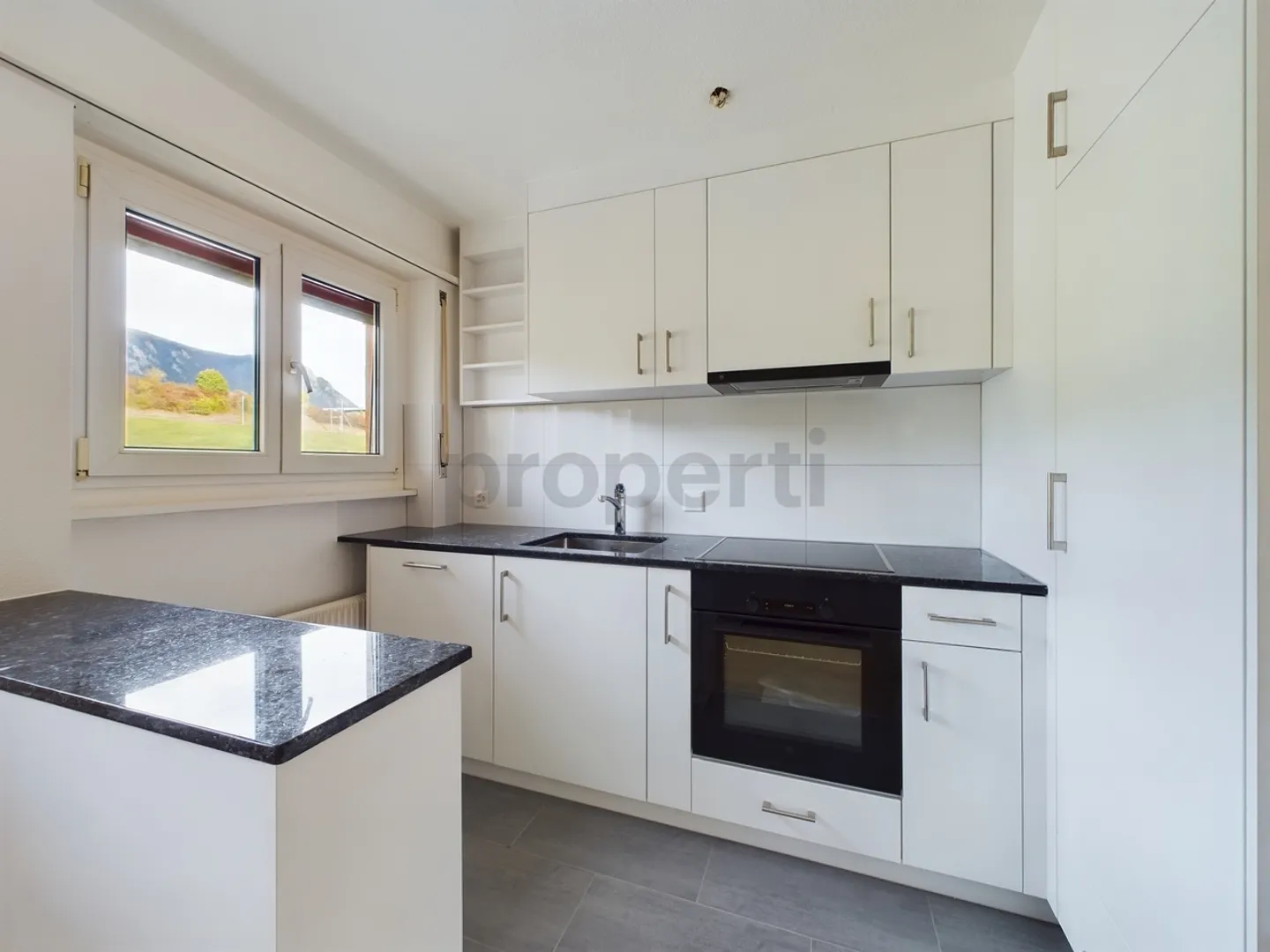 Well-maintained multi-family house with 6 residential units & 9 garages - Photo 6 of 13