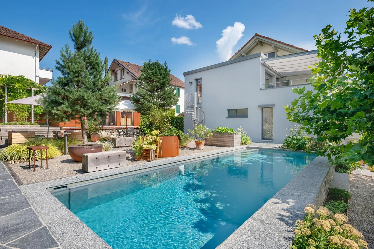 Exclusive two-family house with garden oasis and pool in a preferred location... - Photo 2 of 13