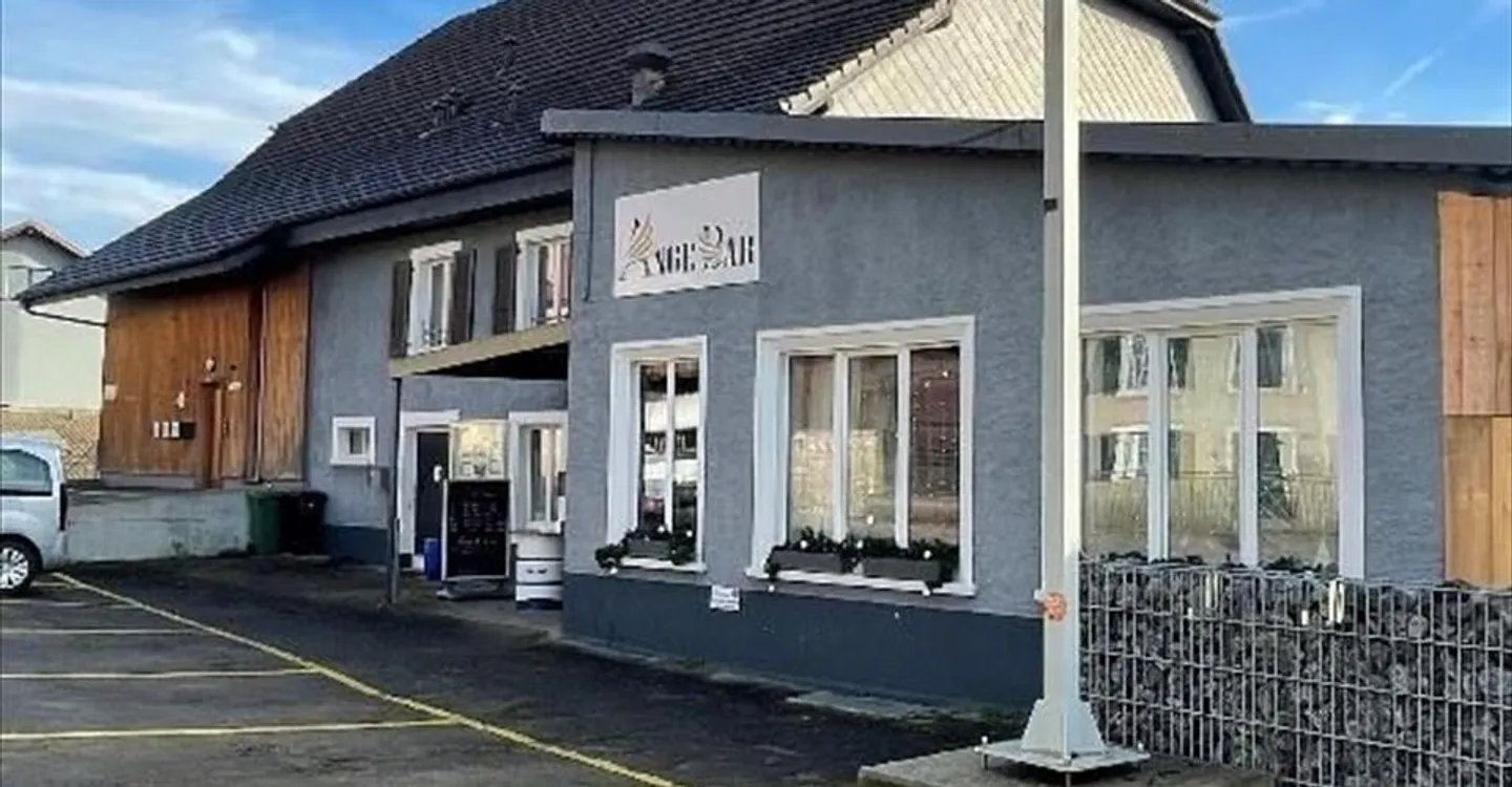 Mixed-Use Building with Restaurant - Photo 3 of 7
