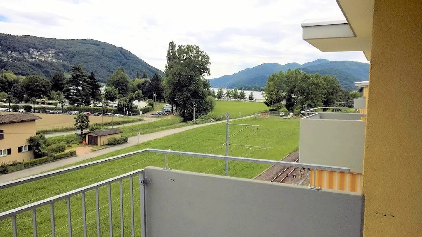 Bellissimo appartamento di 3,5 stanze con vista panoramica ad Agno - Foto 1 di 7
