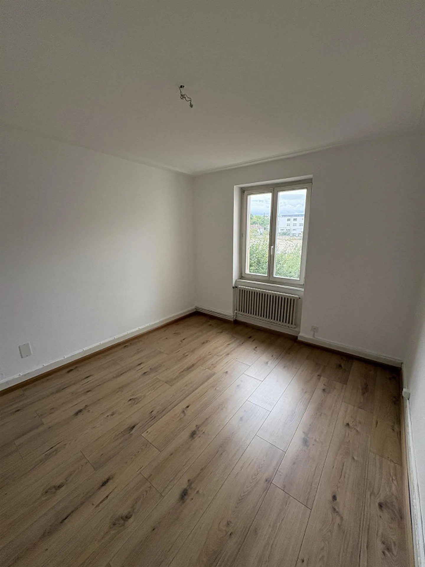 Appartamento duplex 5.5 locali con balcone, giardino e posto auto - Foto 5 di 15