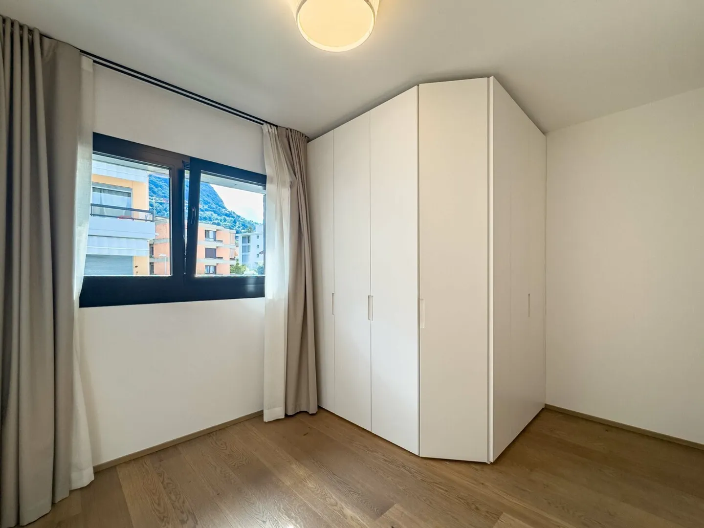Geräumige Penthousewohnung mit Dachterrasse in Pregassona - Foto 7 von 11