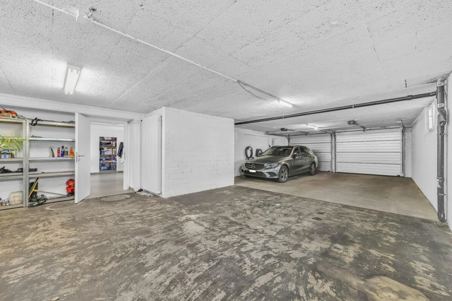 Casa unifamiliare con grande terreno, garage sotterraneo e possibilità di utilizzo versatile - Foto 10 di 15