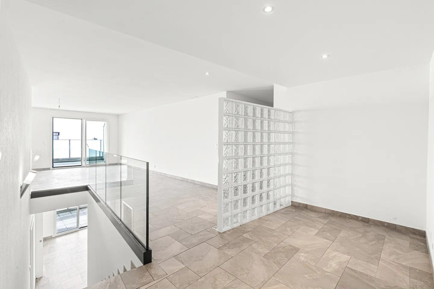 Contemporary duplex bathed in light with stunning lake view! - Photo 2 of 10