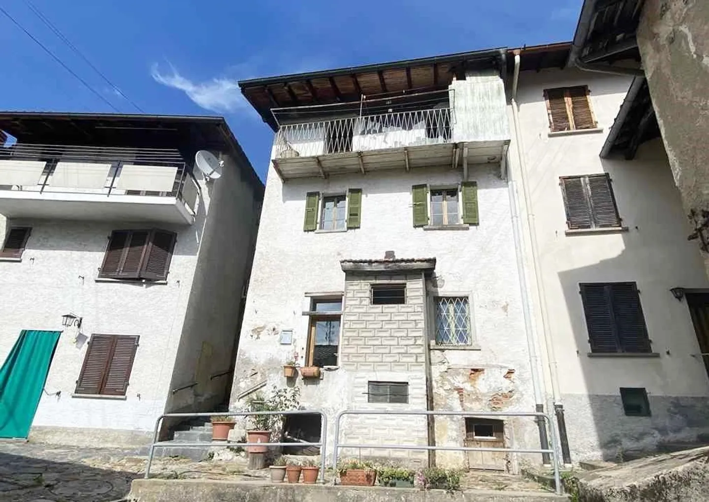 Casa di villaggio di 3 1/2 locali con balcone e vista da ristrutturare - Foto 1 di 15