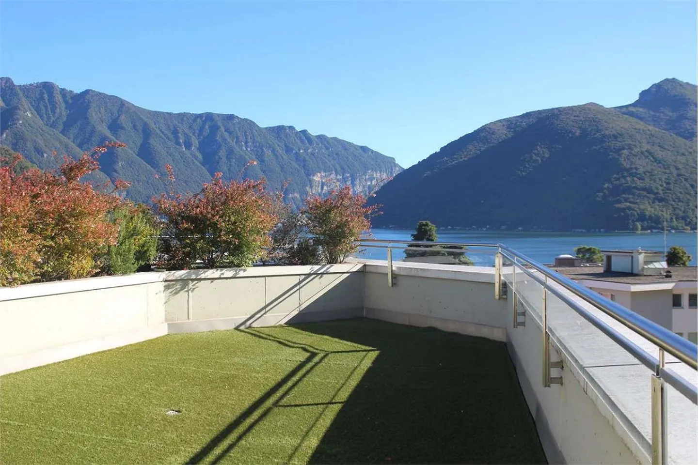 Melide : 4,5 pièces avec vue sur le lac et terrasse sur le toit - Photo 1 sur 8