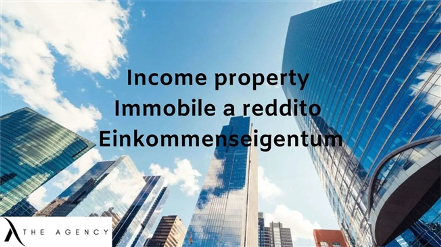 LARGE INCOME BUILDING 5.0 % - Photo 1 of 2