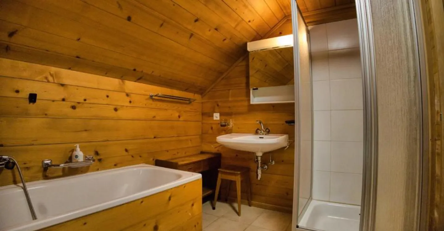 Eine gemütliche 3-Zimmer-Wohnung unter dem Dach im Herzen von Château-d'Oex - Foto 7 von 12