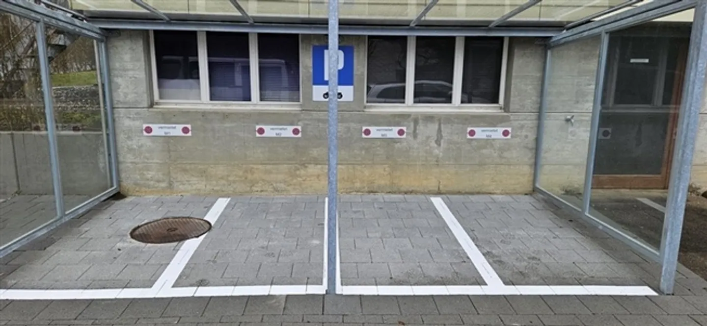 Outdoor motorcycle parking spaces with shelter for rent - Photo 1 of 1