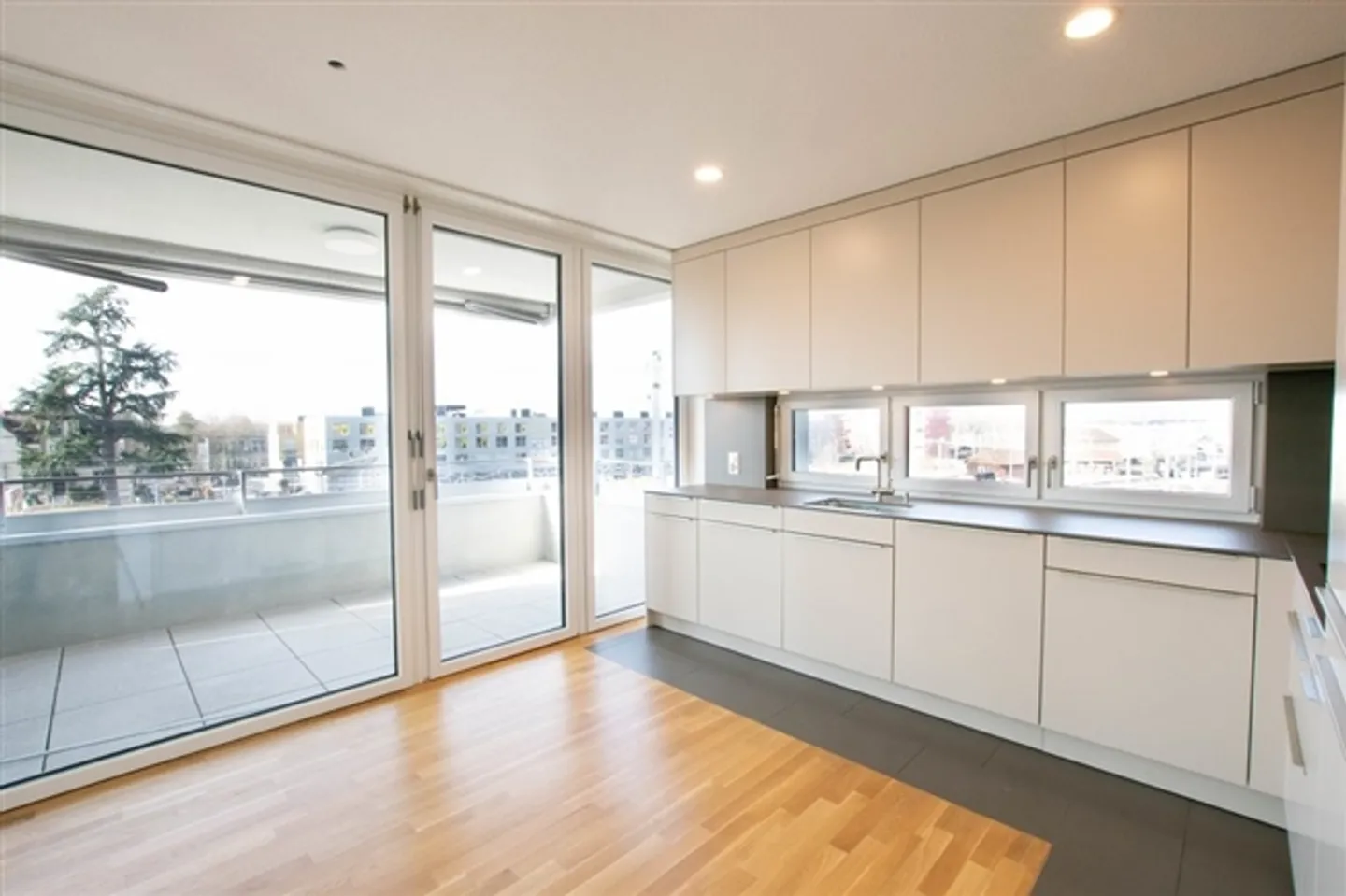 Modern 2.5-room apartment with balcony at the train station in Lyss - Photo 1 of 10