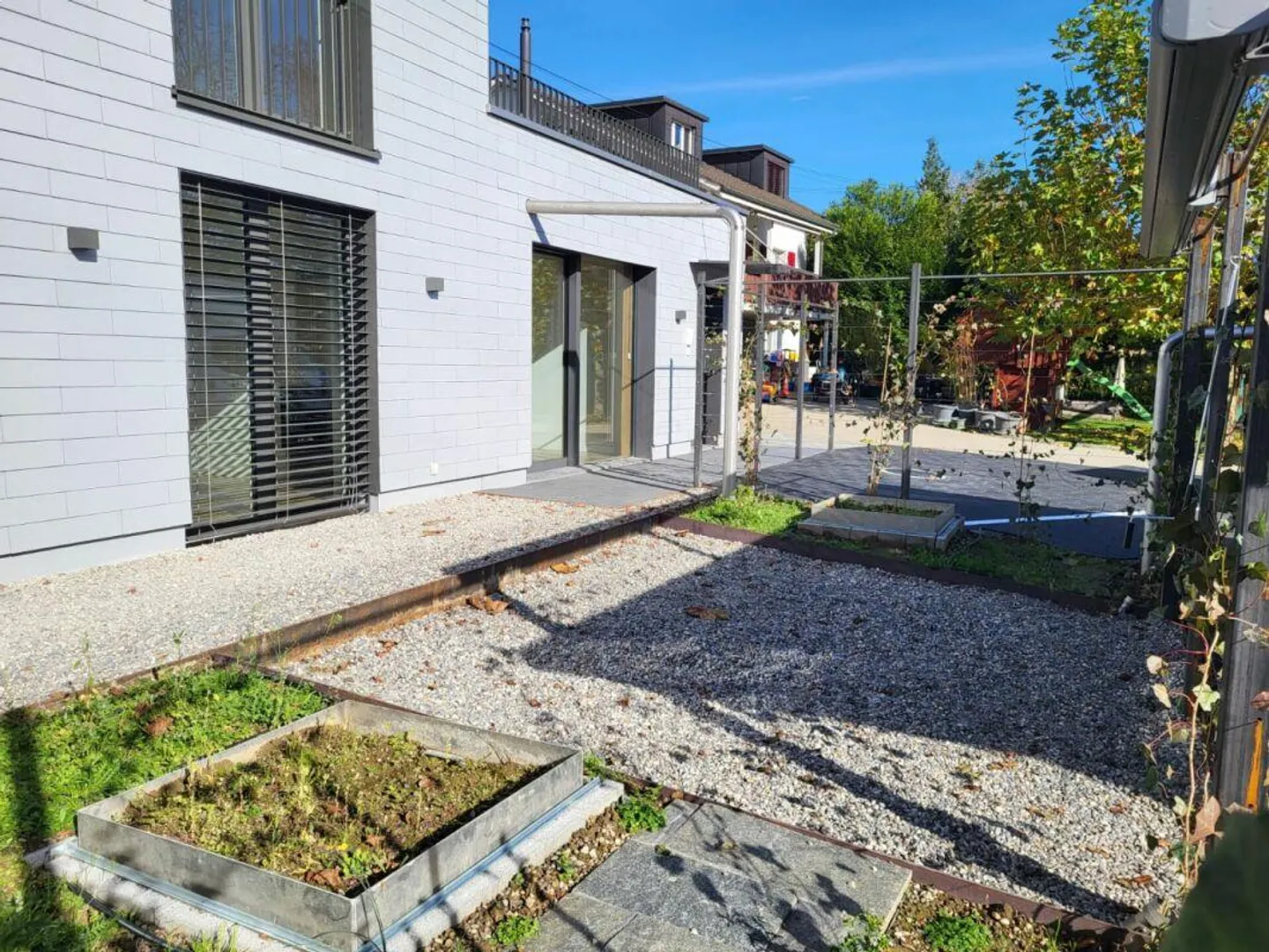 Charmante 4.5-Zimmer-Erdgeschosswohnung mit sonnenverwöhntem Garten - Foto 1 von 11