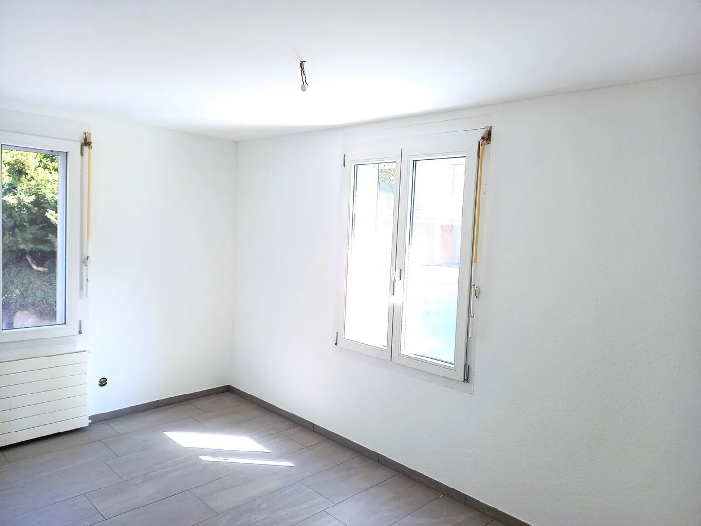 Appartement 3 pièces au rez-de-chaussée surélevé - Photo 2 sur 5