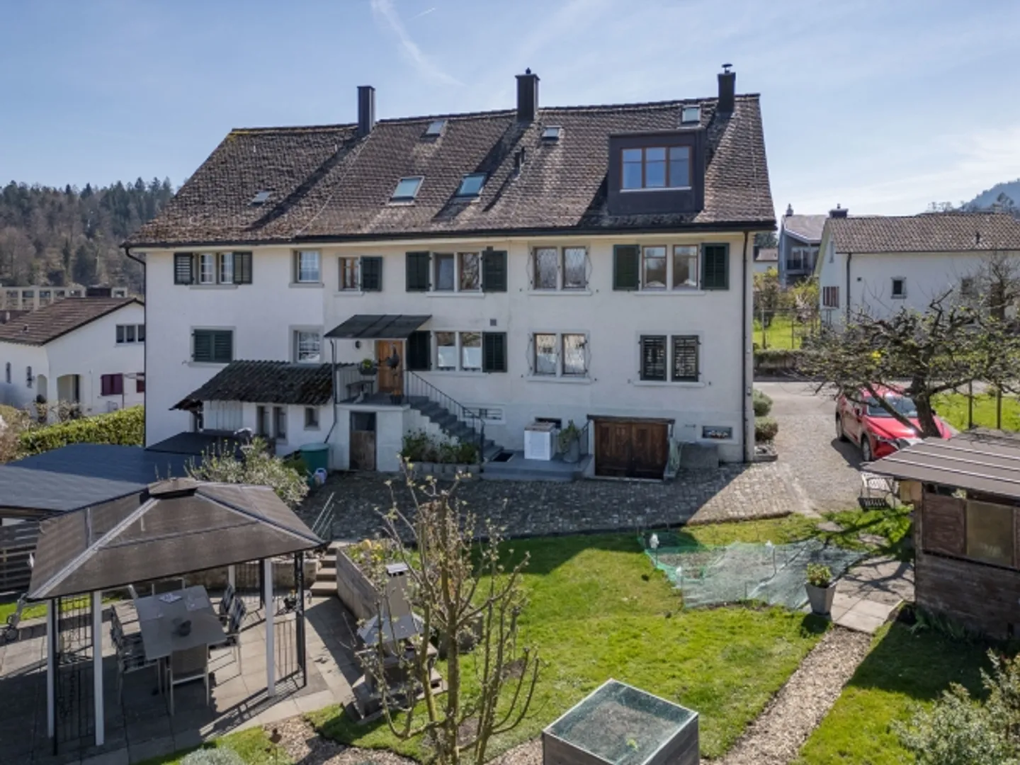 Historical three-family house with generous outdoor area and charm - Photo 1 of 8