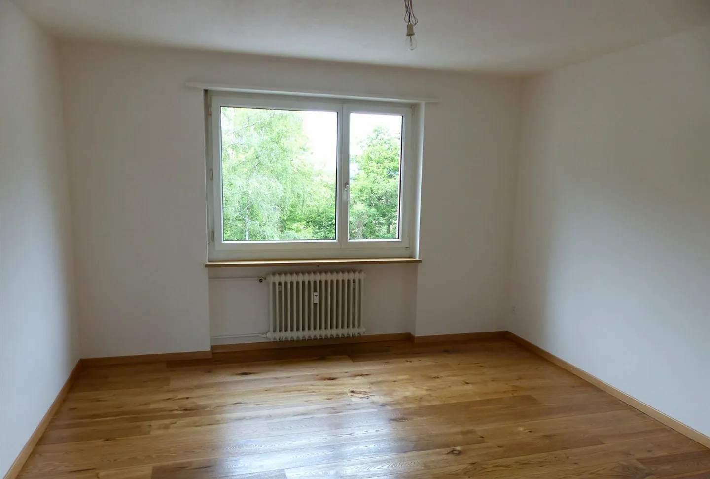Appartement 3.5 pièces dans un emplacement calme au 3ème étage - Photo 2 sur 9