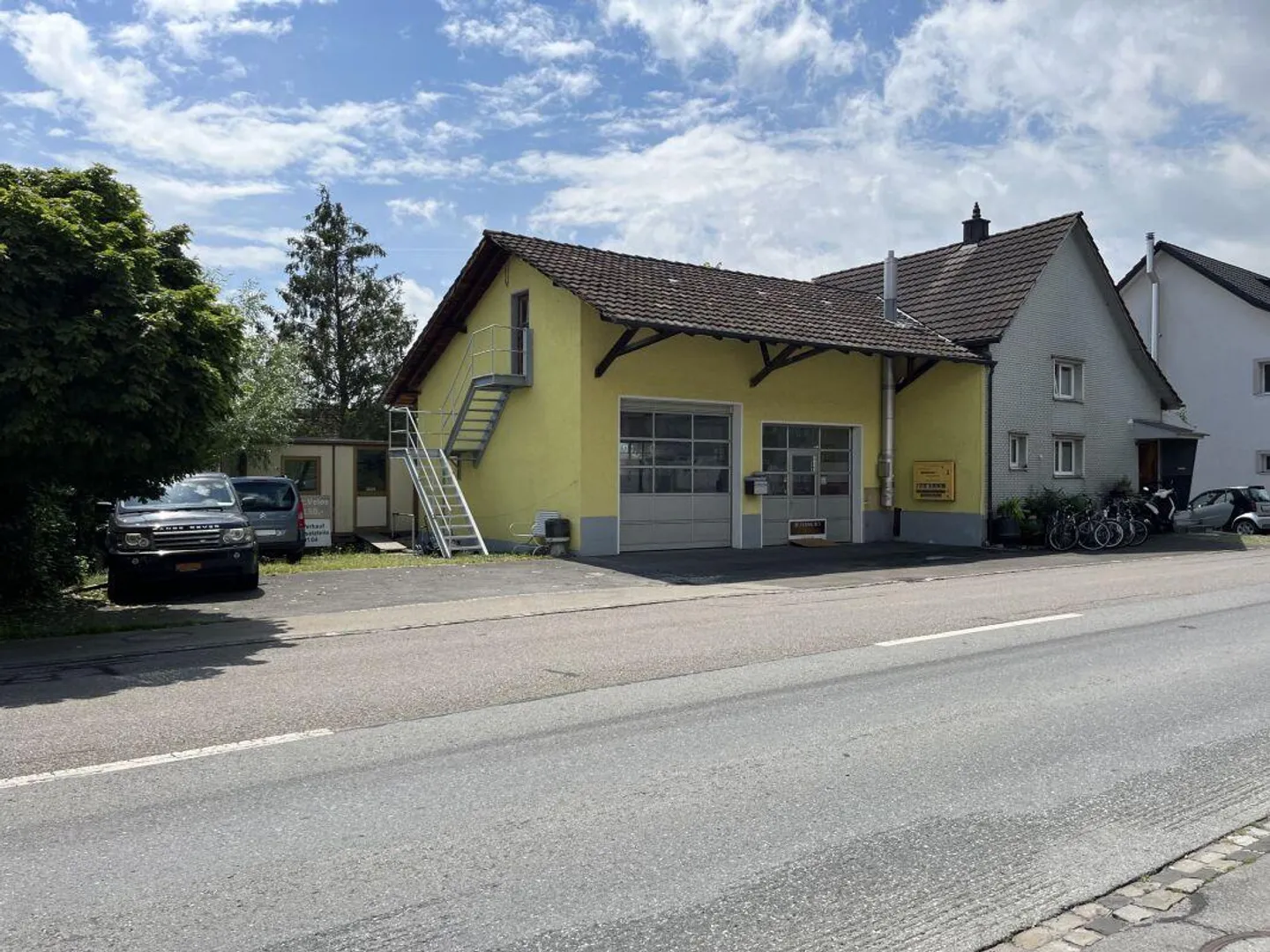 Autogarage mit Wohnhaus - Foto 1 von 7