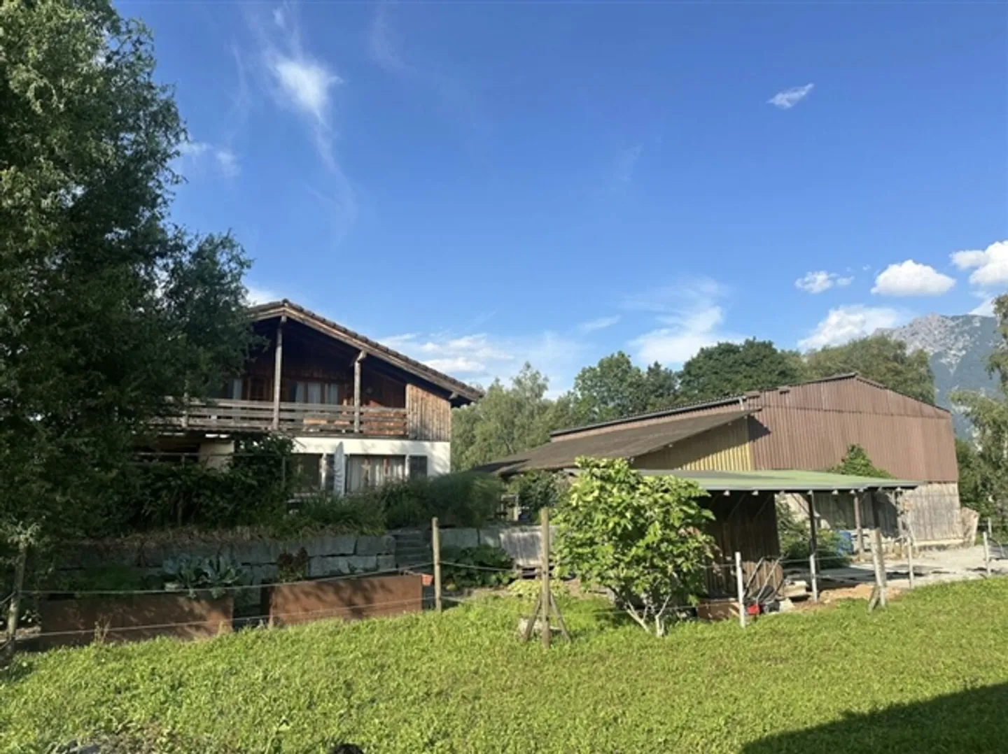 Unique opportunity generous property with single-family house and horse stable - Photo 2 of 12