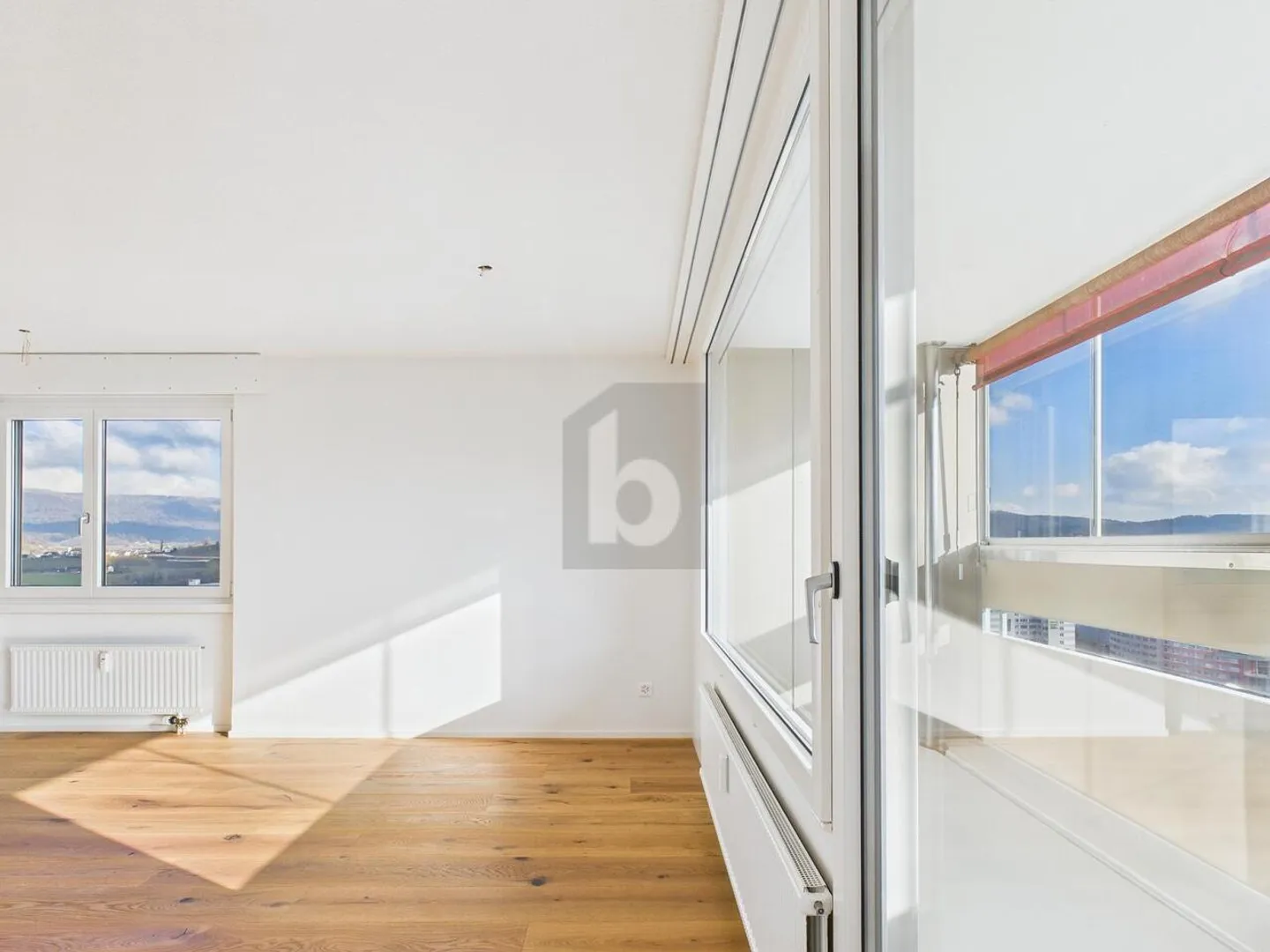 LIGHT-FLOODED WITH A VIEW - Photo 2 of 6