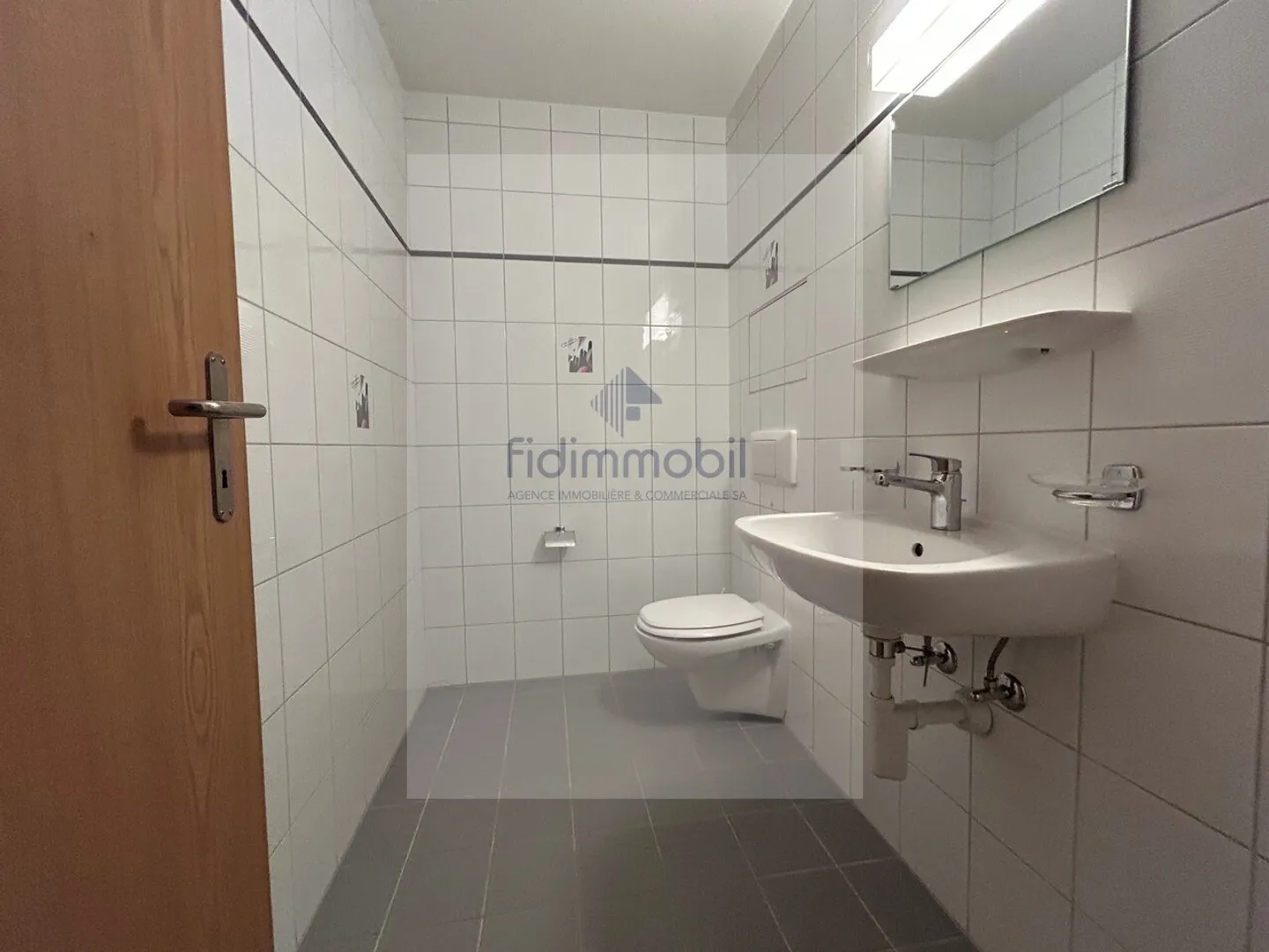 GRAND APPARTEMENT 2.5 CHAMBRES AU REZ-DE-CHAUSSÉE AVEC TERRASSE - Photo 7 sur 11