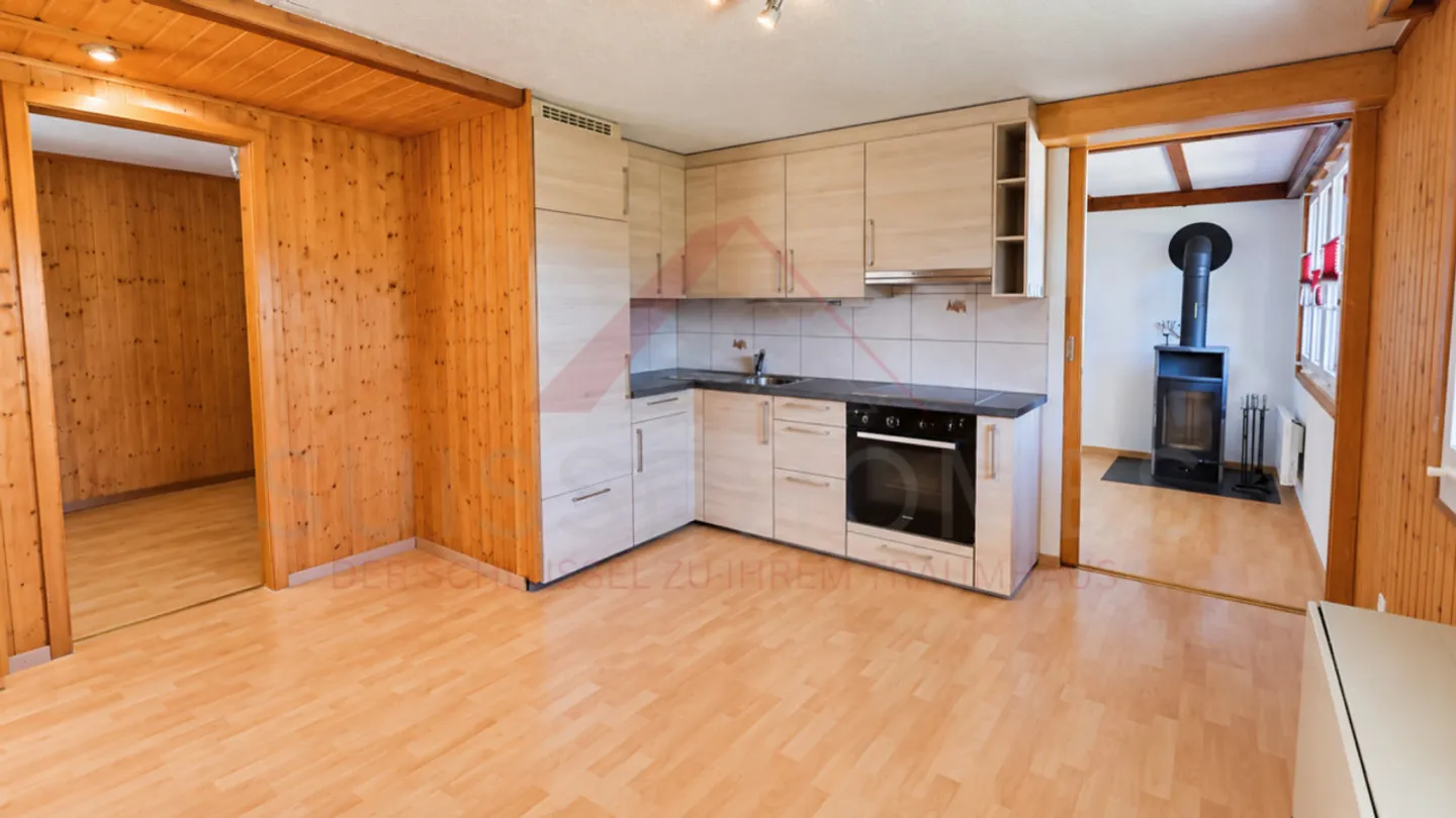 Charming 5.5-Room Chalet with 2 Living Units, Swedish Stoves & Huge Garden Dream in Plasselb - Photo 5 of 15