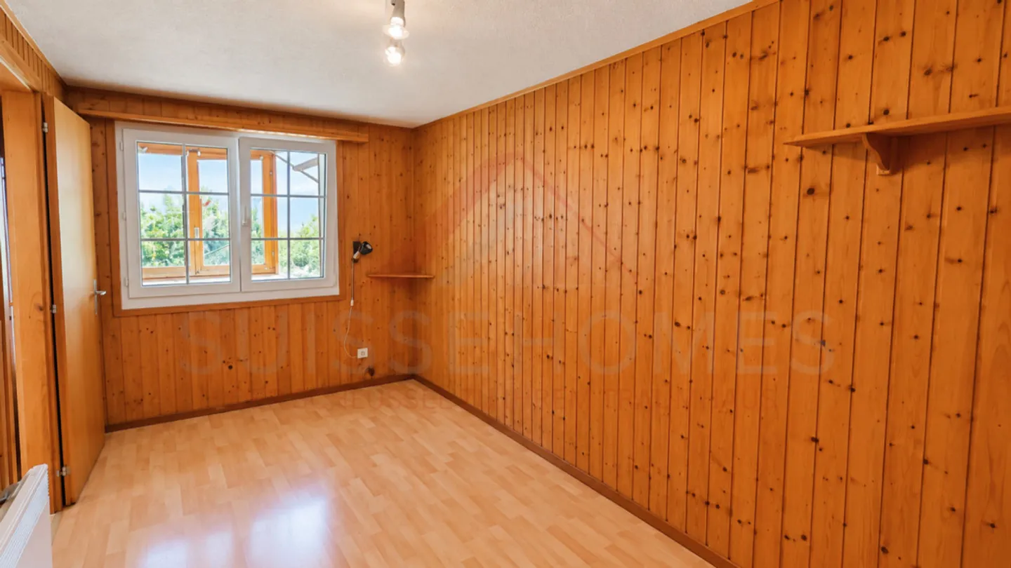 Charming 5.5-Room Chalet with 2 Living Units, Swedish Stoves & Huge Garden Dream in Plasselb - Photo 7 of 15