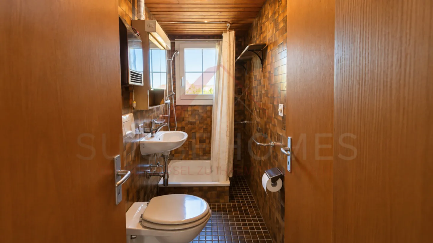 Charming 5.5-Room Chalet with 2 Living Units, Swedish Stoves & Huge Garden Dream in Plasselb - Photo 9 of 15