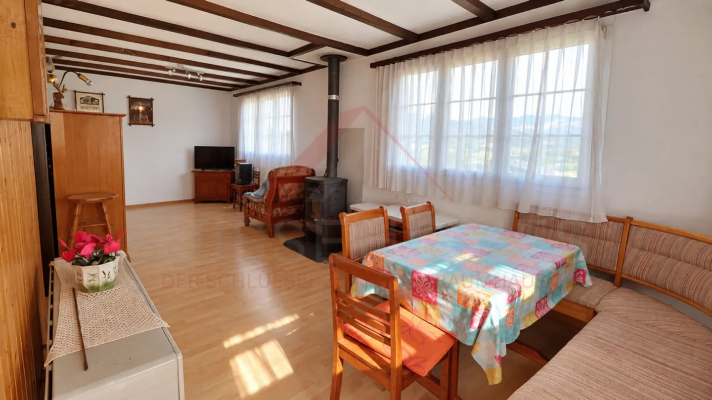 Charming 5.5-Room Chalet with 2 Living Units, Swedish Stoves & Huge Garden Dream in Plasselb - Photo 10 of 15