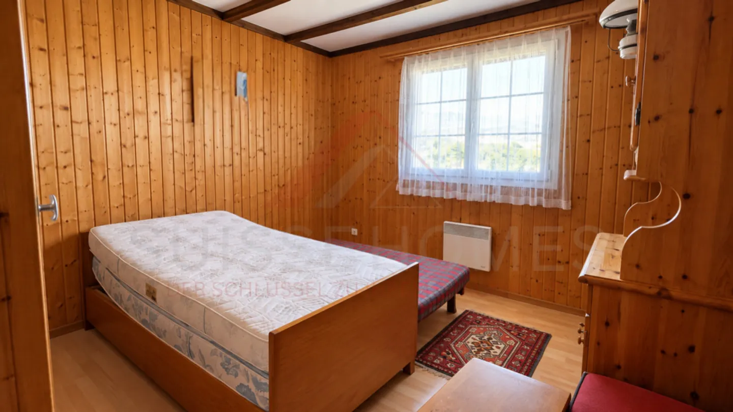 Charming 5.5-Room Chalet with 2 Living Units, Swedish Stoves & Huge Garden Dream in Plasselb - Photo 13 of 15