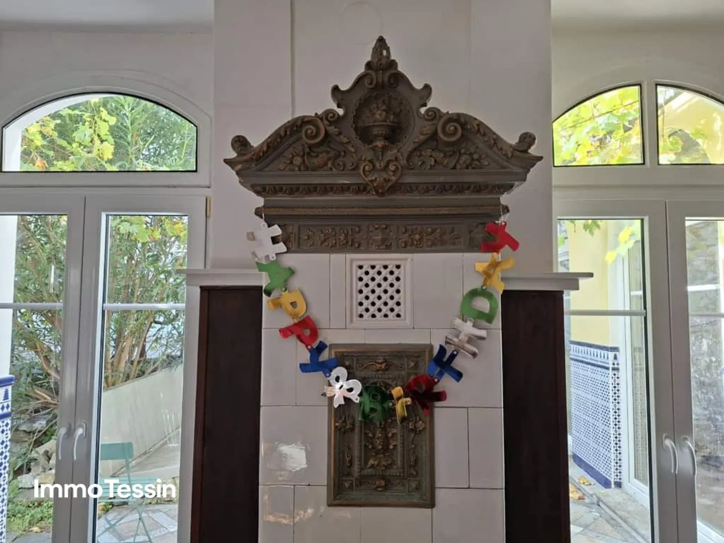 IMMOBILE A REDDITO: Elegante villa in stile Liberty ristrutturata con 6 appartamenti e giardino in una posizione centrale di prima scelta a Muralto - Foto 11 di 13