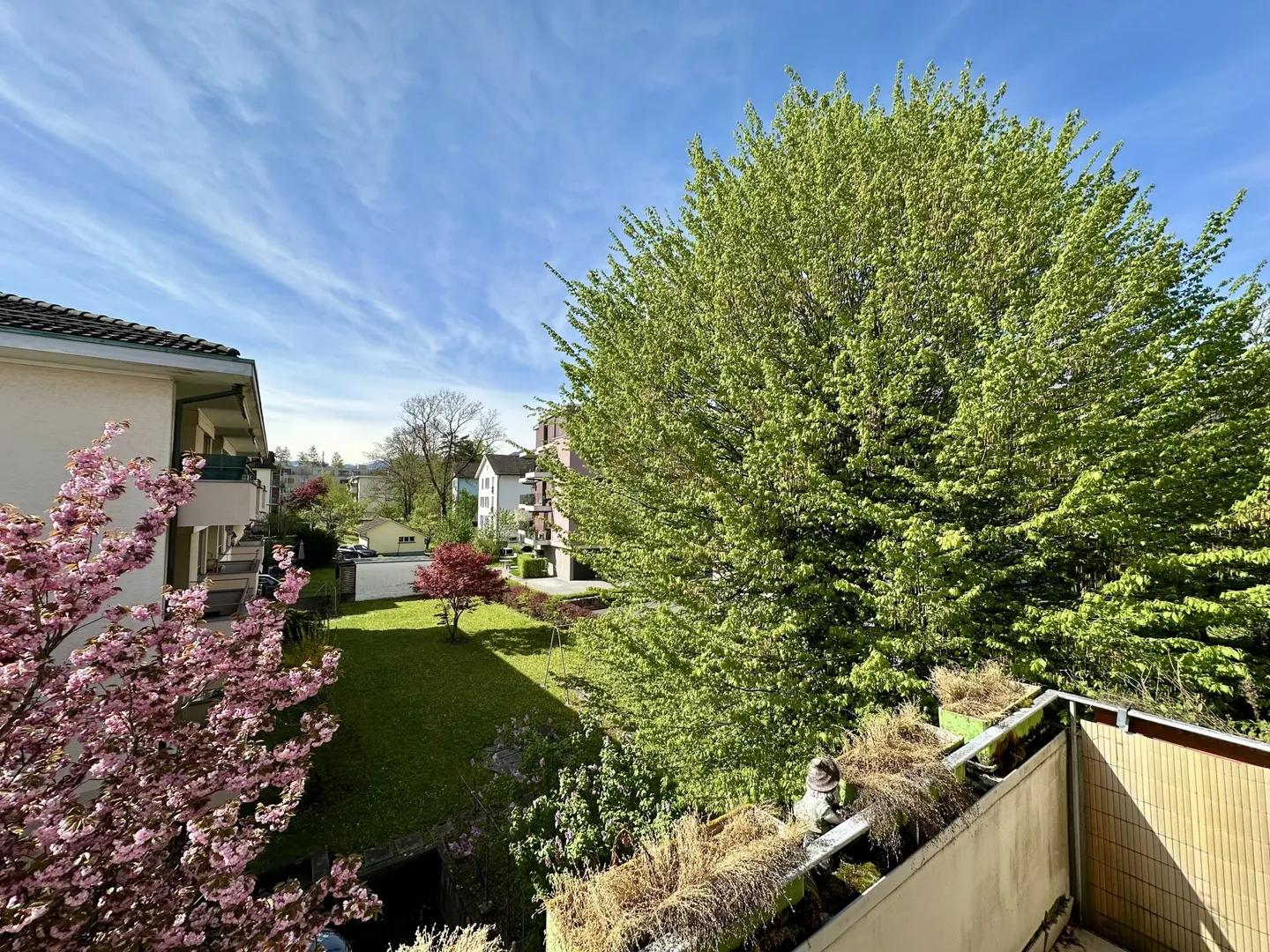 SUNNY BALCONY WITH A VIEW OF THE GREEN - Photo 1 of 9
