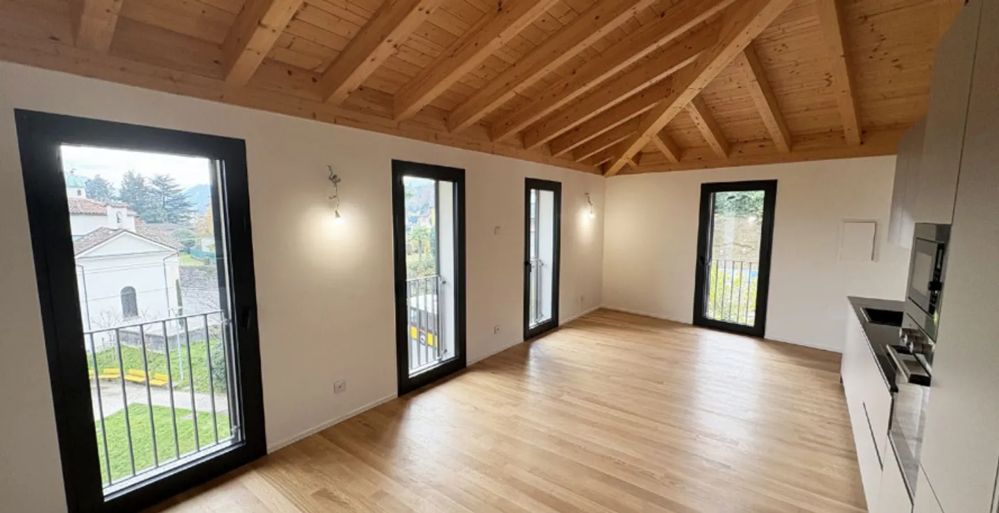 Exklusive Dachgeschosswohnung mit Seeblick in Pura – Moderner Komfort in Position... - Foto 1 von 4