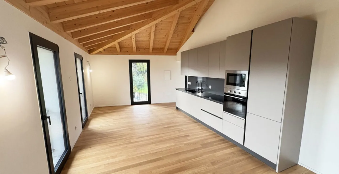 Exklusive Dachgeschosswohnung mit Seeblick in Pura – Moderner Komfort in Position... - Foto 2 von 4