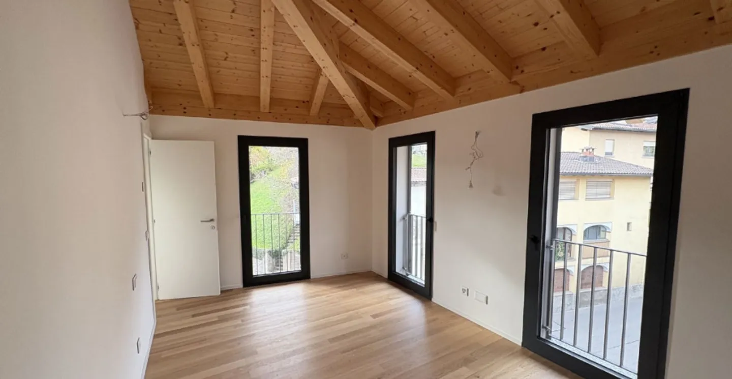 Exklusive Dachgeschosswohnung mit Seeblick in Pura – Moderner Komfort in Position... - Foto 4 von 4