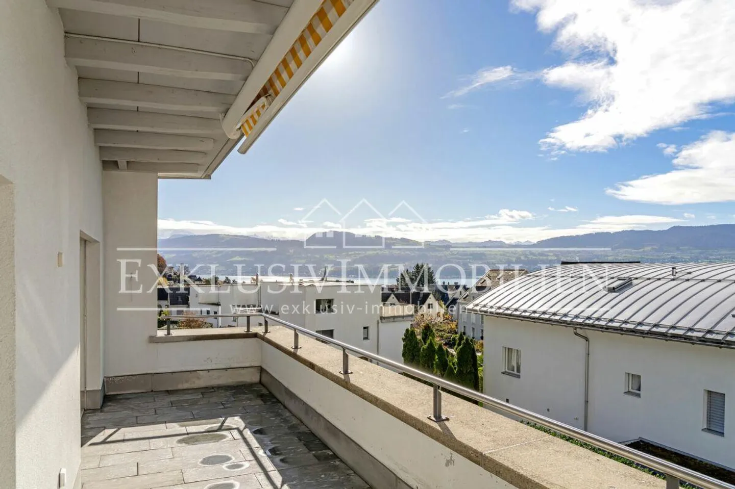 Sunny penthouse gem with partial lake view - Photo 4 of 5