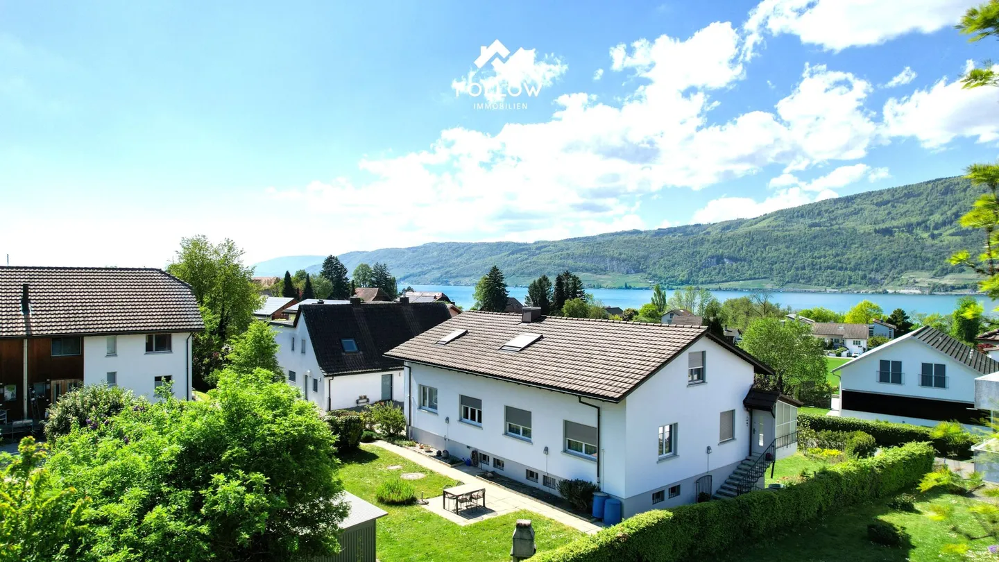 Condominio con vista lago e giardino privato - Foto 1 di 20