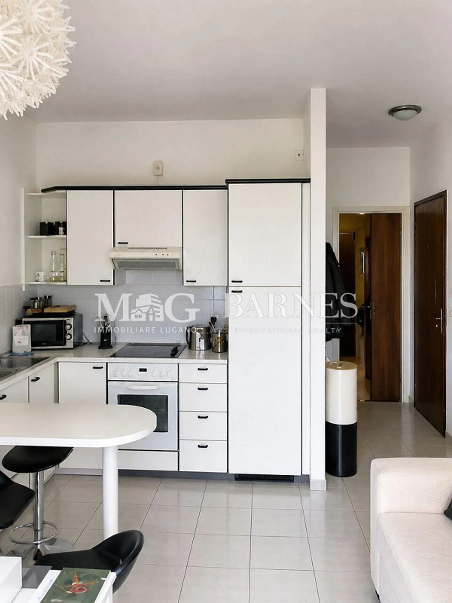 Lugano: Zentrale 2,5-Zimmer-Wohnung mit Balkon und Garage - Foto 3 von 4