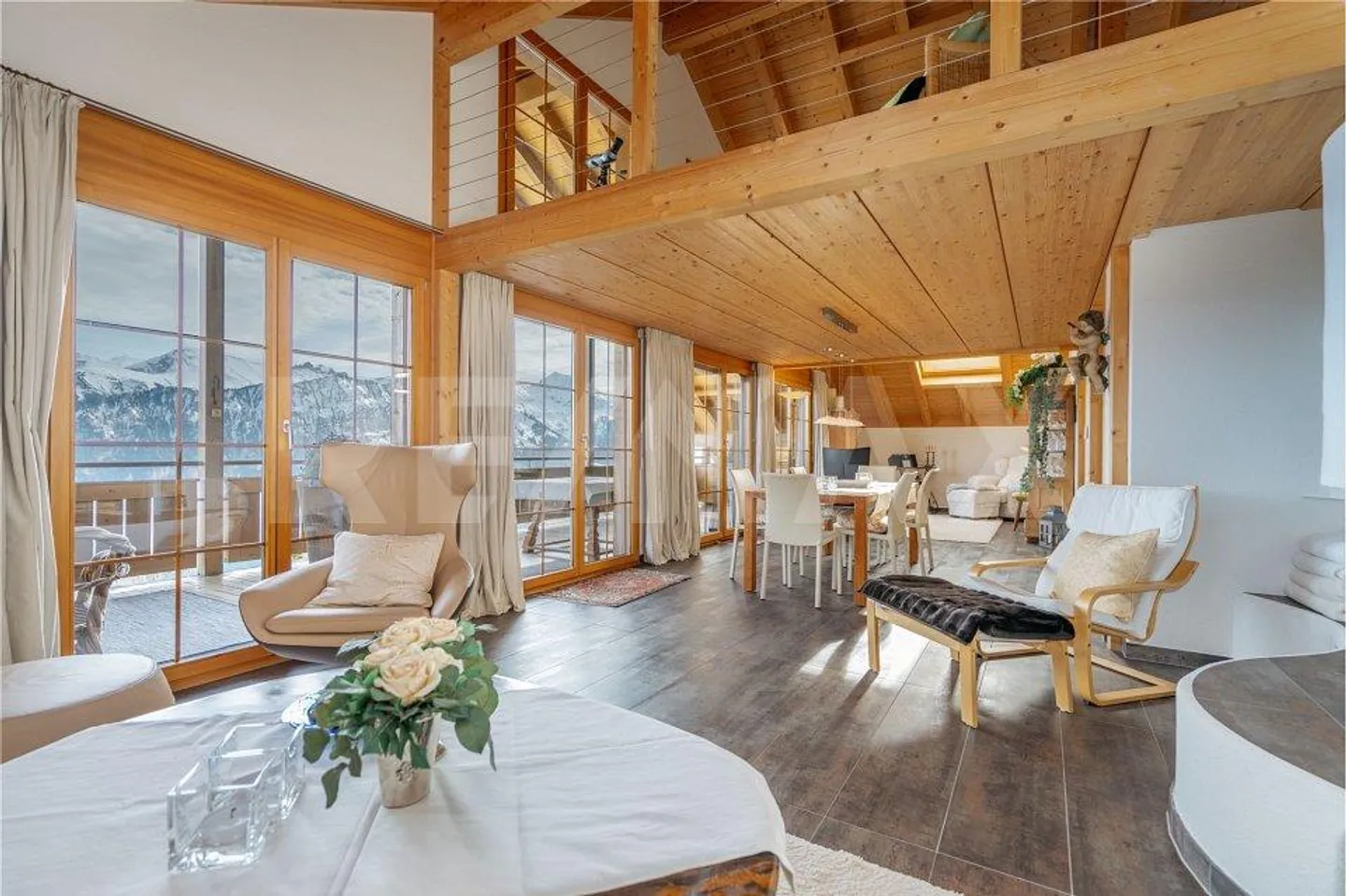 A prime location with plenty of privacy. High-quality penthouse duplex with a panorama of lake and mountains - Photo 1 of 13