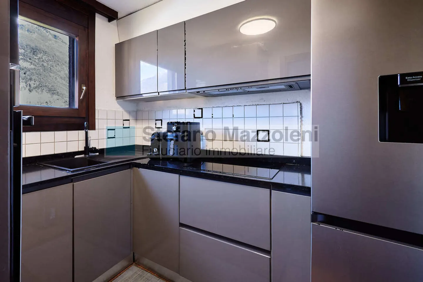 ARBEDO - À vendre un joli appartement mansardé de 2,5 pièces à Arbedo - Photo 4 sur 12