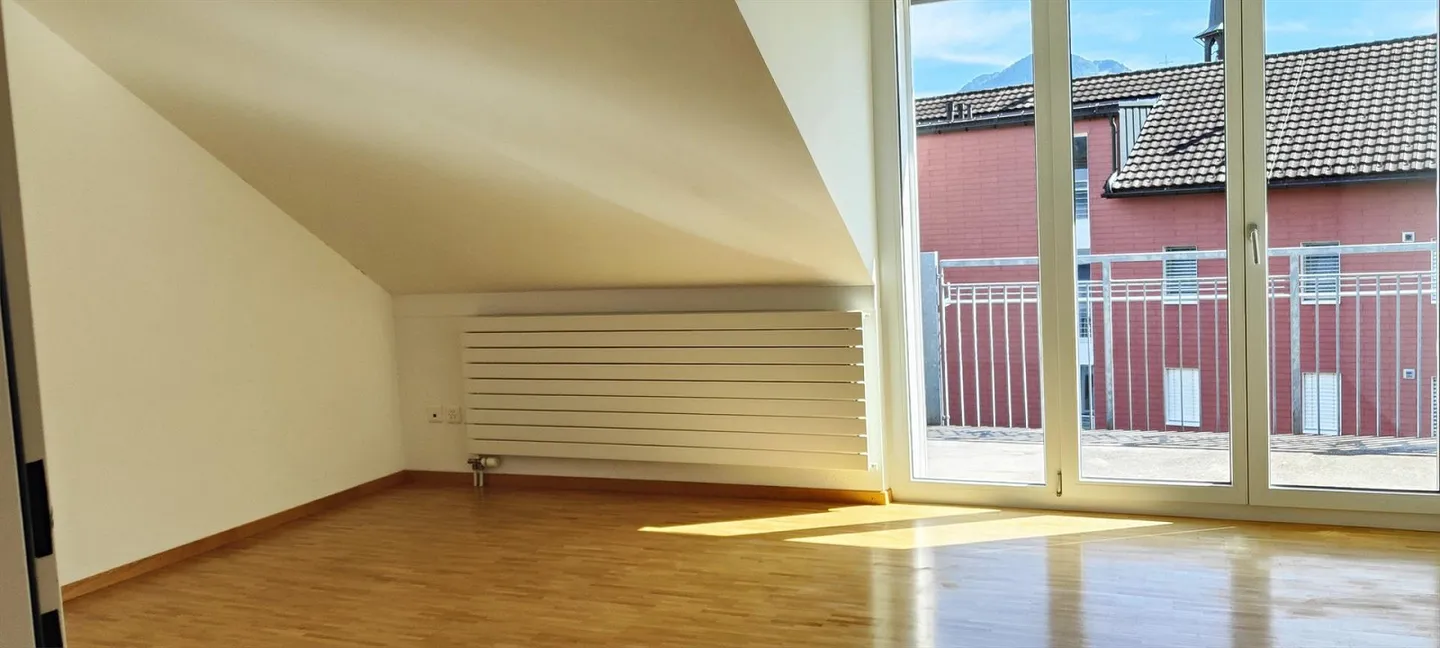 Geräumige Dachwohnung - Foto 7 von 13