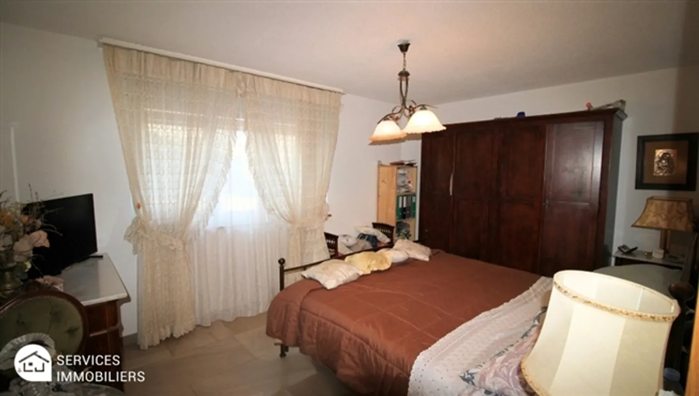 Appartement confortable au niveau du jardin - Photo 8 sur 18