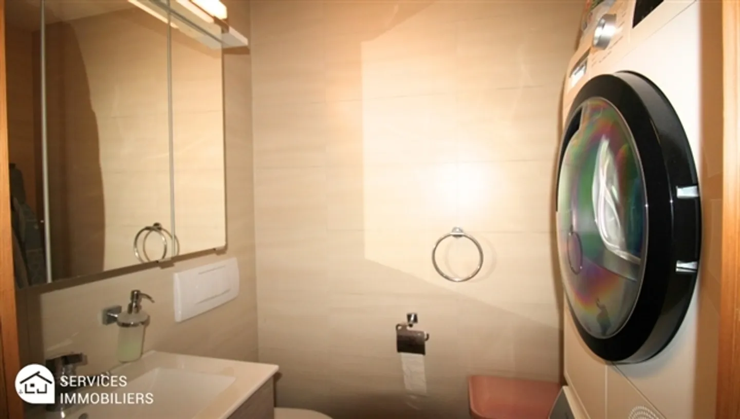 Appartement confortable au niveau du jardin - Photo 15 sur 18