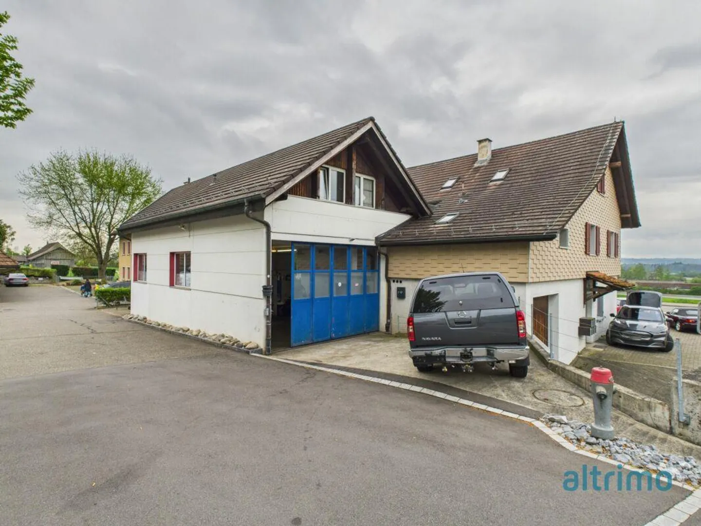 Edificio multifunzionale con showroom, officina e unità abitative - Foto 12 di 16