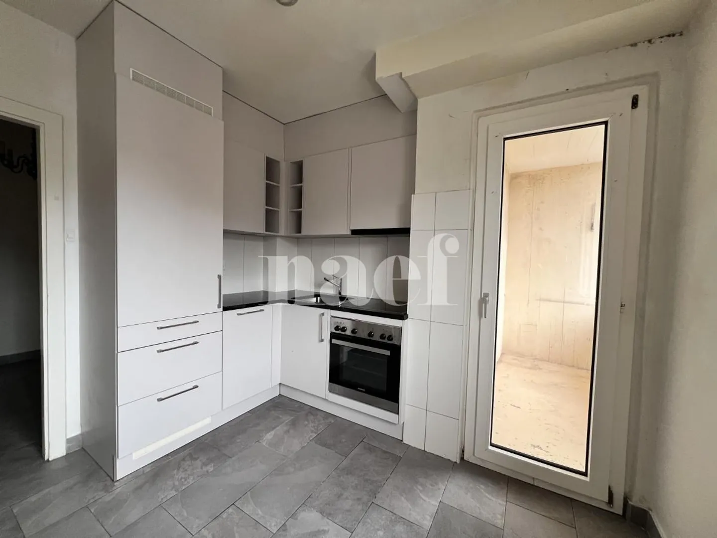 3,5-Zimmer-Wohnung im 5. Stock in Fribourg! - Foto 2 von 9