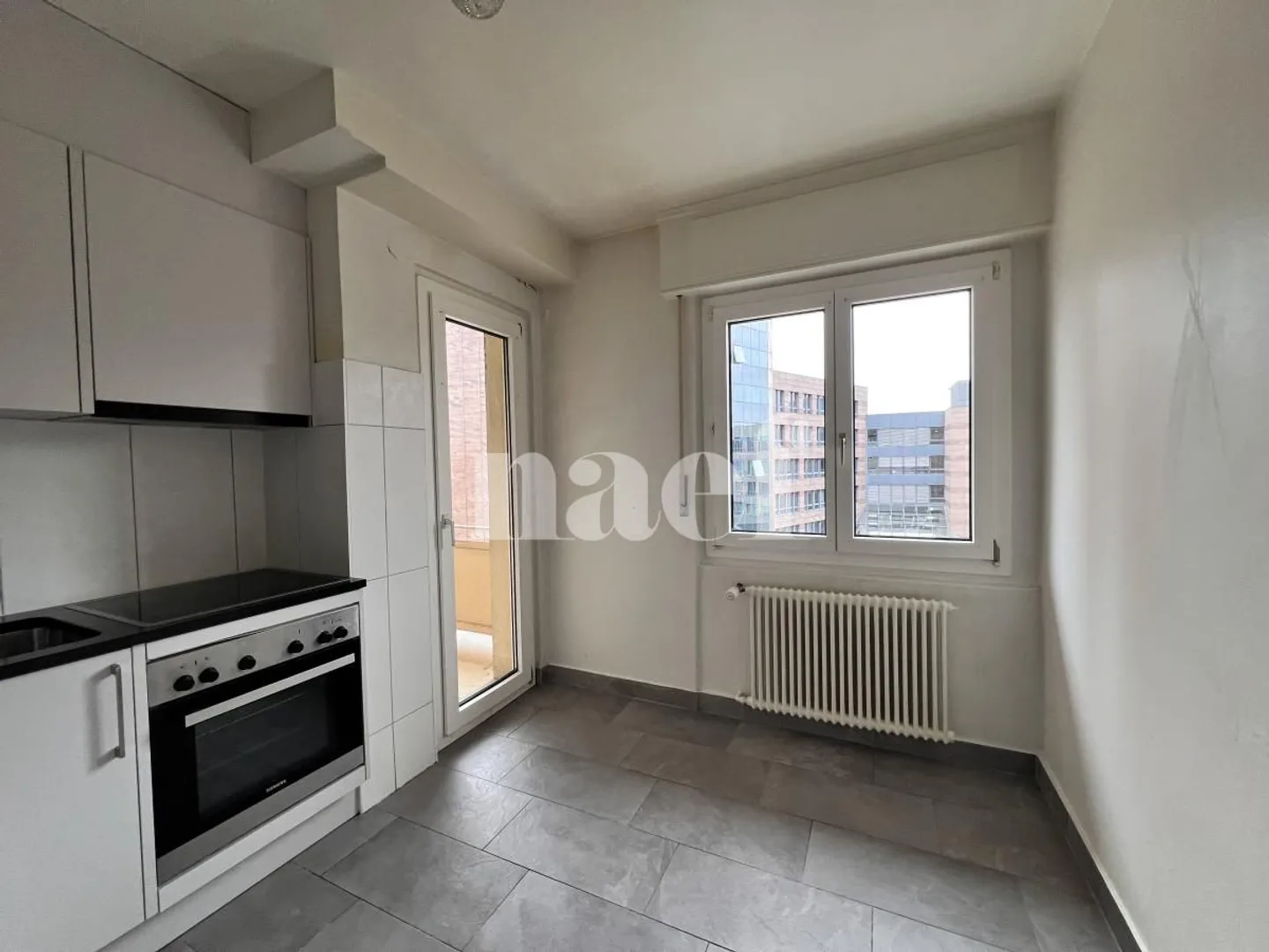 3,5-Zimmer-Wohnung im 5. Stock in Fribourg! - Foto 1 von 9