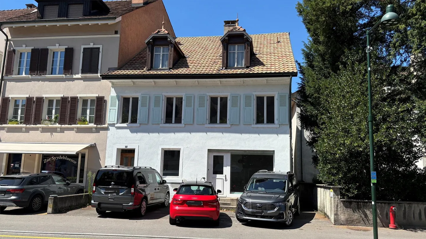 Versatile residential and commercial building in the center of Muttenz - Photo 1 of 13