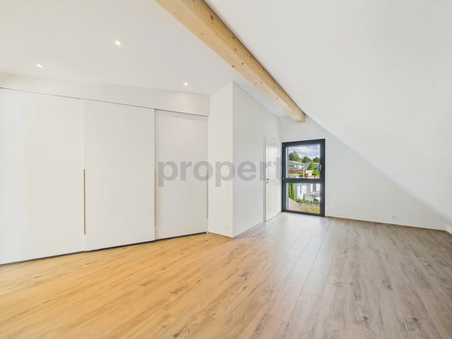 Penthouse apartment directly at the edge of the forest with a view of Lake Zurich, Minergie standard and free cooling - Photo 7 of 13