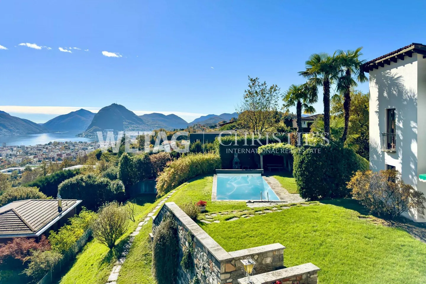 Representative villa in Lugano-Comano for sale, with outdoor pool & magnificent view of Lake Lugano - Photo 1 of 13