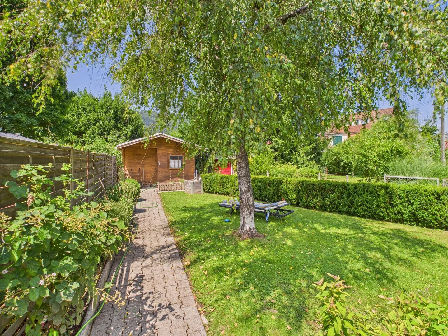 Charmantes Einfamilienhaus mit grosszügigem Garten - Foto 1 von 13