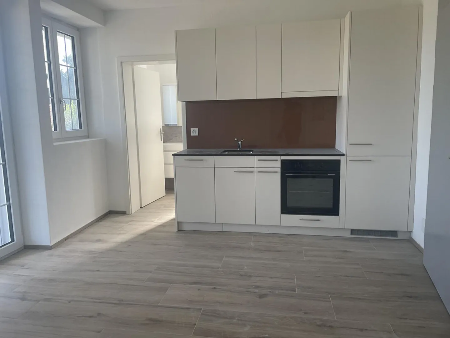2 Zimmer Gartenwohnung in der ehemaligen Uhrenfabrik Wolfwil - Foto 2 von 5